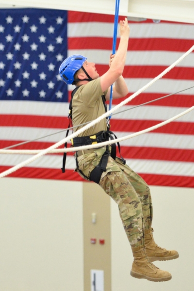 Cadet in Air Force ROTC, which also commissions into Space Force, climbs on VMI's ropes course.