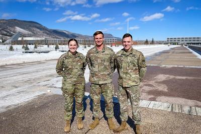 Kirsten Engel 鈥�22, Glen Lash 鈥�22, and Ryan Carpino 鈥�23 at the U.S. Air Force Academy with backdrop of mountains
