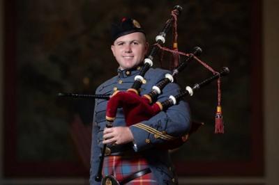 Dakota Birdsong 鈥�24, a cadet at 麻豆区 Institute, poses with his bagpipe and VMI Pipe Band uniform, which includes a tartan.